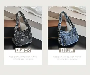 Detail view of denim shoulder bags in black and blue with white daisy floral patterns