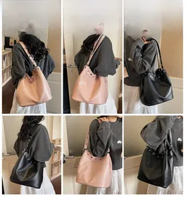 Detailed views of high-capacity pink and black tote bags with metal eyelet strap details