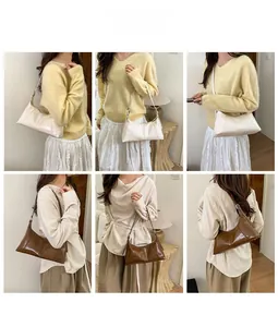 Detail view of retro hobo bag in cream and brown with adjustable silver buckles