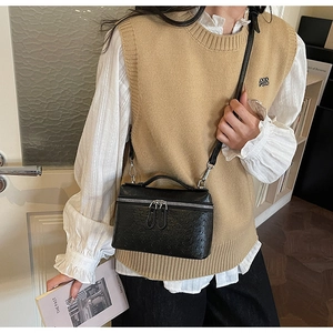Elegant black ostrich embossed square crossbody bag with handle and dual zipper design
