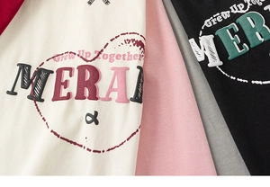 Detail of soft cotton kids t-shirts featuring premium raised foam puff print slogans