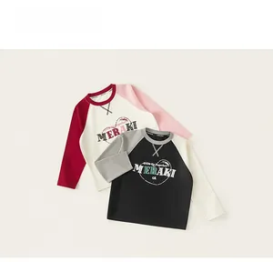 Detail of girls cotton raglan long sleeve shirts with heart print in red and black