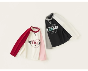 Detail of raglan sleeves and Meraki print on girls' long sleeve cotton t-shirts