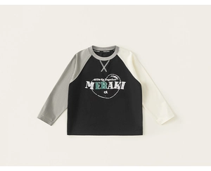 Detail view of cotton raglan sleeve stitching and vintage heart print on kids T-shirt