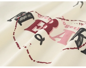 Detail shot of vintage cream fabric with high-quality graphic print and stitching