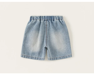 Flat lay of light blue denim shorts for boys showing elastic waistband and fabric texture