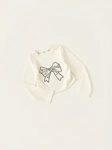 T-shirt fille à manches longues crème avec motif nœud noir dessiné à la main