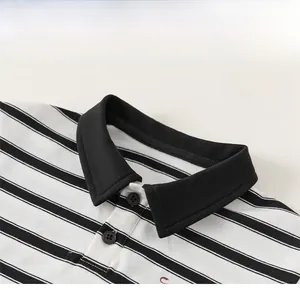 Detailed close-up of children striped polo shirt collar with black buttons and soft fabric