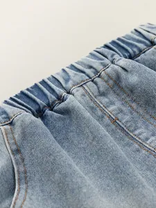 Boy's light blue washed denim shorts with elastic waist and stylish stitching details