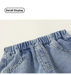 Detailed macro view of elastic waistband and stitching on light blue denim shorts