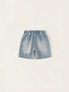 Loose fit boys light blue denim shorts with elastic waist and distressed details