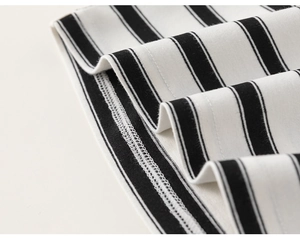 Close-up of high-quality sewing and stitching on the striped cotton kids' clothing set