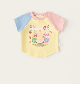 Detail of color block kids t-shirt featuring yellow body and cartoon bear illustration
