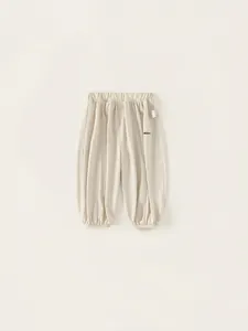 Pantalon de jogging enfant en coton crème avec taille élastique et chevilles resserrées