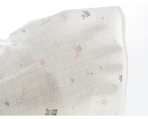 Detailed macro view of thin white cotton fabric with cute animal prints and light blue grid