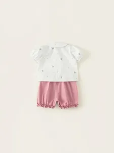 Girls summer two-piece outfit with floral doll collar shirt and pink ruffle shorts