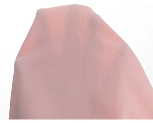 Detail shot of sheer light pink fabric showing lightweight texture and breathability