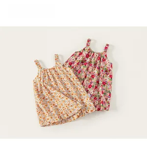 Detailed view of the breathable cotton floral patterns and shoulder straps on summer dresses