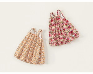 Detailed flat lay of toddler floral summer dresses with delicate shoulder straps