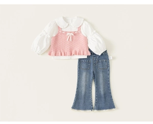 Detail of pink knit vest with bow and ruffle hem on girls denim three-piece set