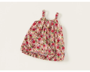 Detailed view of kids floral sundress with elastic straps and colorful flower print