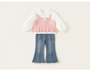 Flat lay of girls' 3-piece set with ruffled shirt, knit vest, and flared jeans