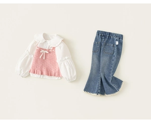 Detail of girls' spring outfit with ruffle collar shirt and pink knit vest