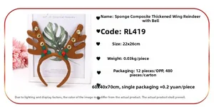 Detailed view of Christmas reindeer antlers headband with gold bells and green leaves