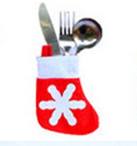 Close-up of red and white snowflake Christmas stocking silverware holder with cutlery