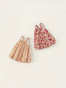 Girls floral summer suspender dresses in bright orange and pink cotton fabrics
