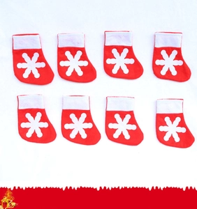Set of eight red mini Christmas socks with white felt snowflake for cutlery holder decoration