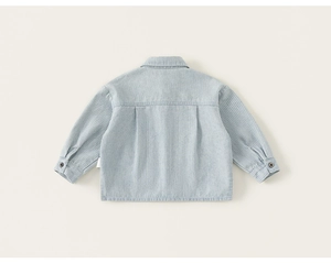 Detail view of the back of light blue striped cotton shirt with double pleats and drop shoulder