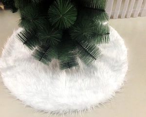 Detailed view of plush white faux fur Christmas tree skirt with soft texture