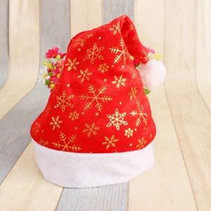 Classic red plush Christmas hat with golden snowflake patterns and white fur trim
