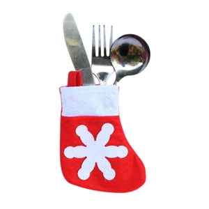 Mini Christmas stocking cutlery holder with snowflake patterns on white background