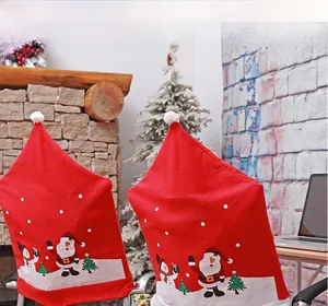 Detail of Christmas chair cover showing Santa and snowman prints with plush white pom-pom