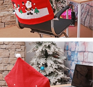 Detail of Christmas chair covers with Santa Claus and snowman prints for festive decor