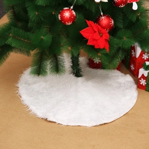 Round white plush Christmas tree skirt with soft faux fur texture for holiday home decoration