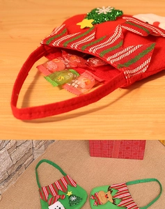 Detail of Christmas felt gift bags featuring 3D Santa and Reindeer designs for candy