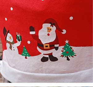 Close-up of Christmas chair cover with Santa and snowman print on red non-woven fabric