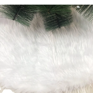 Plush white faux fur Christmas tree skirt for elegant holiday home decor and tree base cover