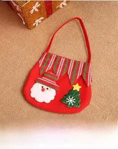 Detail of red felt Christmas gift bag featuring 3D Santa Claus and tree decorations