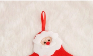 Close-up of Santa Claus felt pocket for Christmas countdown calendar with velvet rope