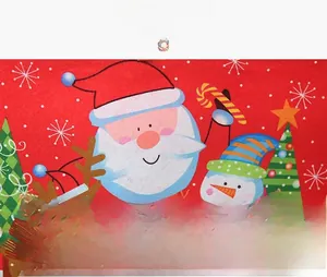 Detail of Christmas chair cover showing high-quality printed Santa and reindeer patterns
