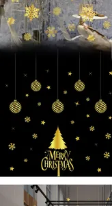 Close-up of gold Christmas snowflake and bauble static stickers for glass window displays