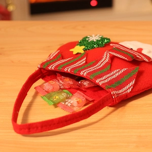 Christmas felt gift bag with Santa Claus design and green sequin tree decoration