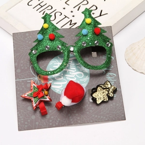 Christmas accessory set with tree glasses and festive star clips on a decorative gift card