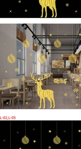 Detail of golden geometric reindeer and snowflake static window stickers for Christmas decor