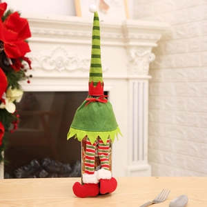 Christmas elf wine bottle cover set with green hat and striped legs for holiday table decor