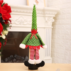 Christmas elf wine bottle cover with green polka dots and striped legs for festive decor